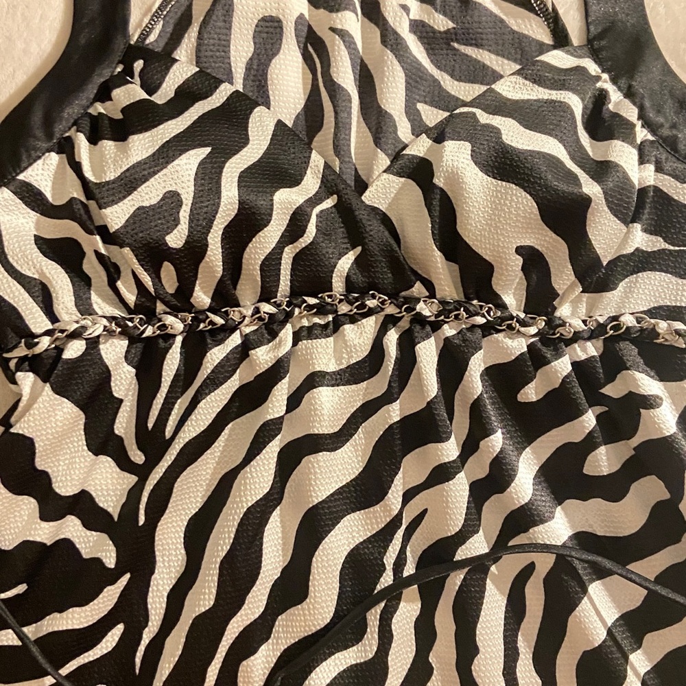 Ladies super cute black and white spaghetti strap top. I wore it one time.